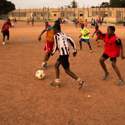 A Projects Abroad volunteer work with teens to teach football in Ghana. A Projects Abroad volunteer work with teens to teach football in Ghana.